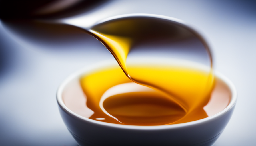 An image that showcases a close-up view of a vibrant yellow turmeric tea being poured into a delicate, translucent tea cup