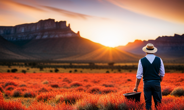 An image that captures the serene beauty of South Africa's Cederberg Mountains, showcasing a farmer carefully harvesting vibrant red Rooibos leaves, immersed in the breathtaking landscape that gifts the world with this beloved herbal tea